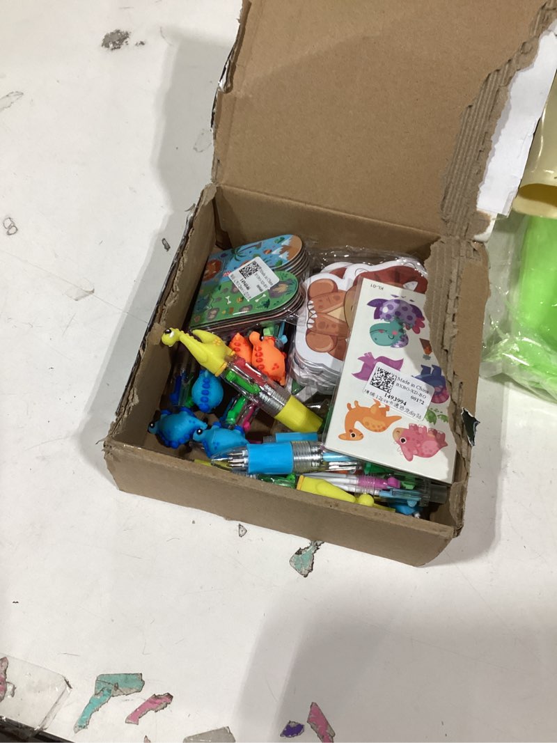 Condition photo showing As Is for 60Pcs Dinosaur Party Favors for Kids - 12 Sets Dino Goodie Bags with 4-in-1 Pens (0.5mm), Stickers, Sticky Notes, Bookmarks & Gift Bags - Birthday Party Supplies
