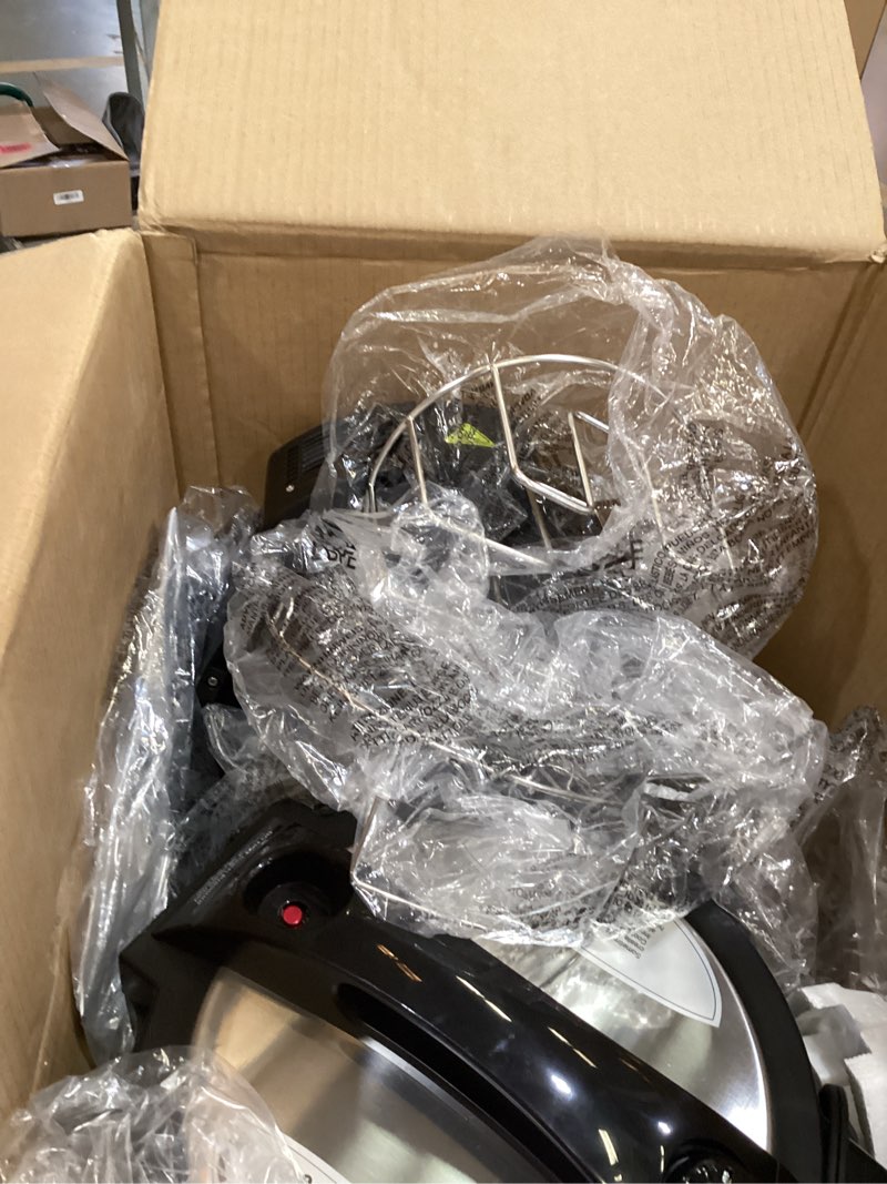 Condition photo showing As Is for nuwave duet air fryer, electric pressure cooker & grill combo, 540 in 1 multicooker with 3 removable lids, slow cook, sautés, dehydrator, 18/10 ss pot, sure-lock safety tech & 13 deluxe accessories 9 accessories.incomplete