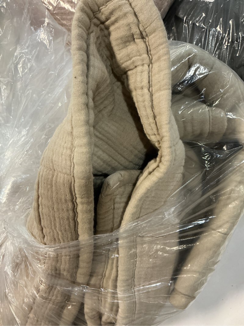Condition photo showing New/Like New for quince beige organic blanket