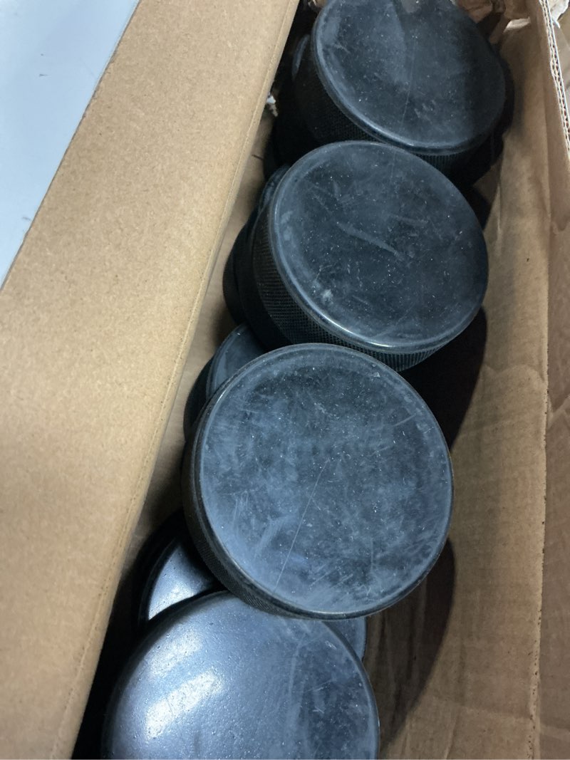 Condition photo showing Good Condition for hockey pucks bulk 25 practice pucks per case official new