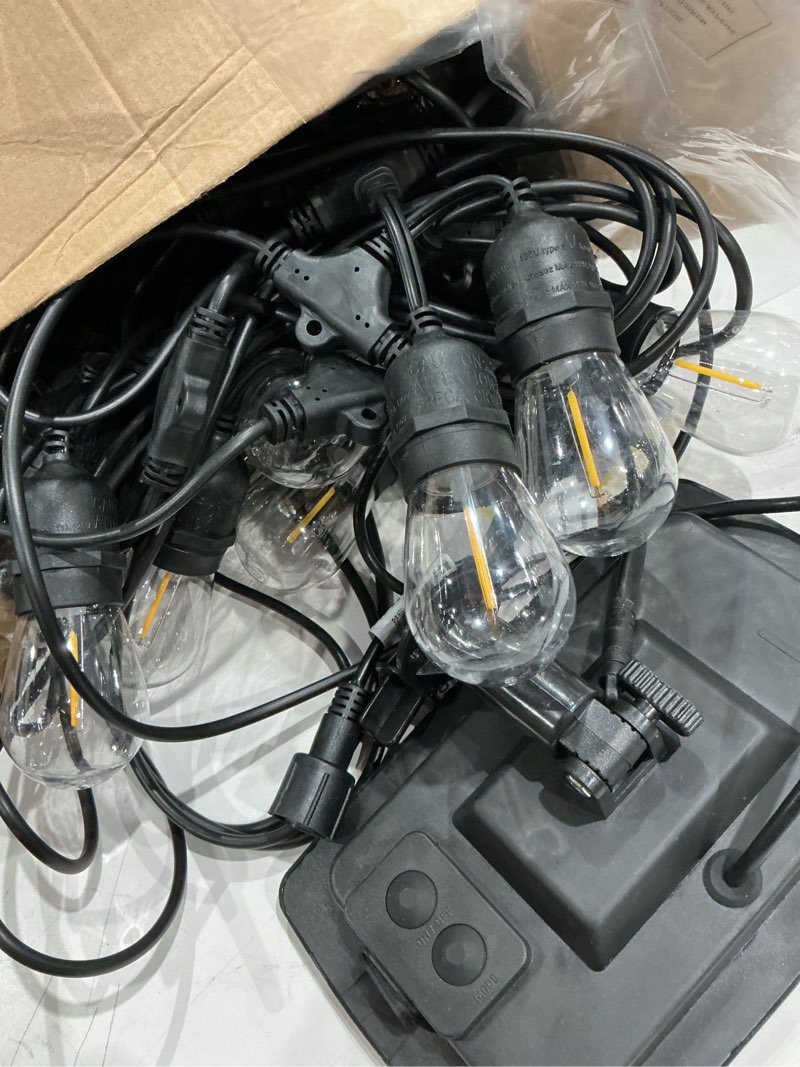 Condition photo showing As Is for harbor breeze 48-ft solar black indoor/outdoor string light with 20 white -light led edison bulbs