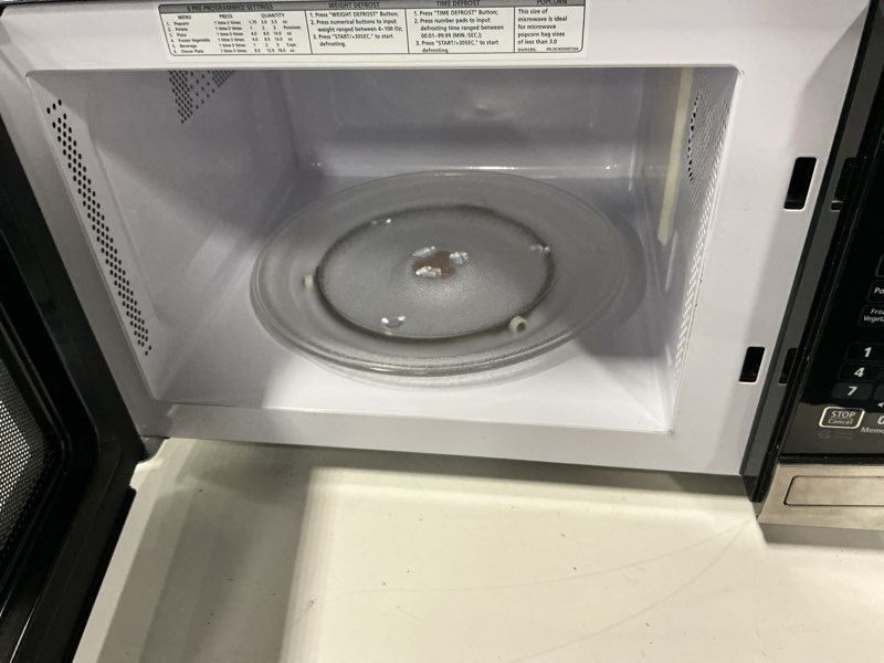 Condition photo showing As Is for Insignia™ - 0.9 Cu. Ft. Compact Microwave - Stainless Steel