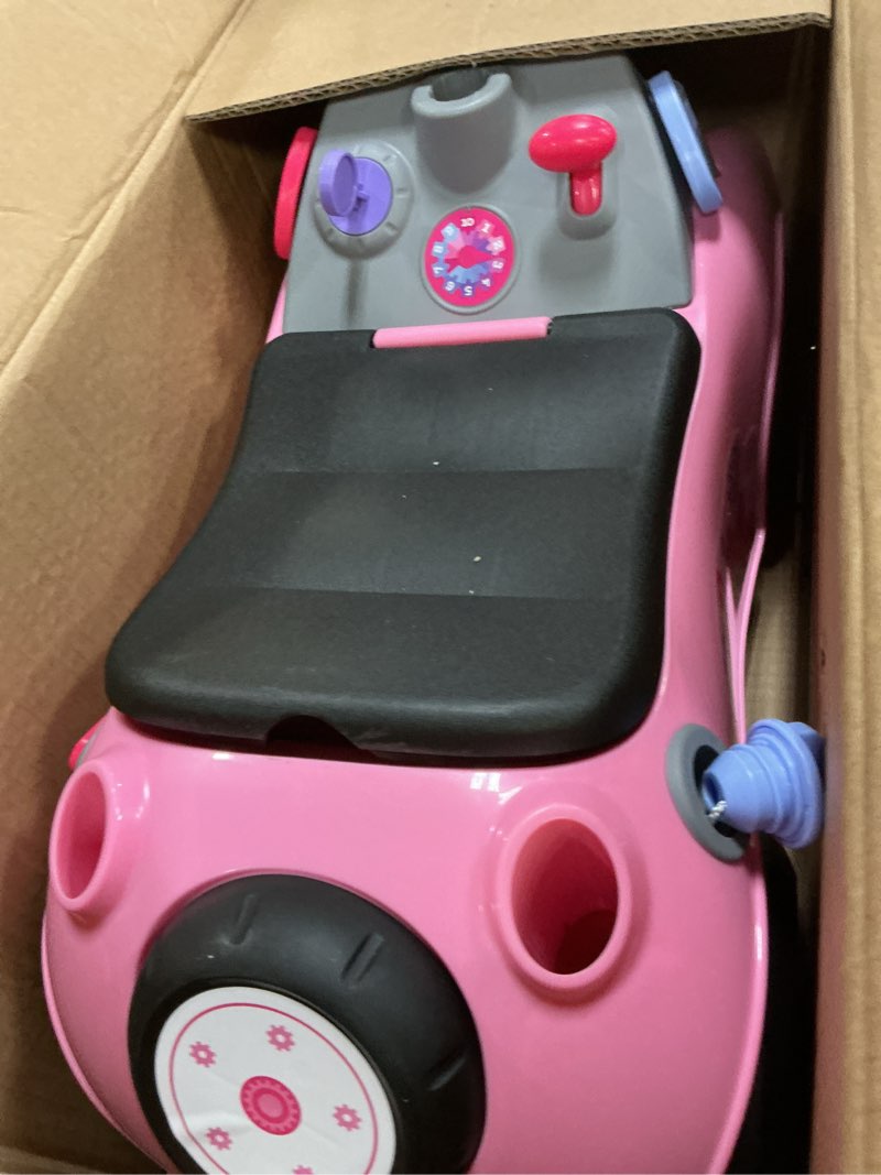 Condition photo showing As Is for radio flyer creativity car, for toddlers 1-3, 3-in-1 push walker ride on rocket with 17 sensory activities, anti-tip feature, under-seat storage, horn and gears, 42 lb capacity, toddler ride on toys pink