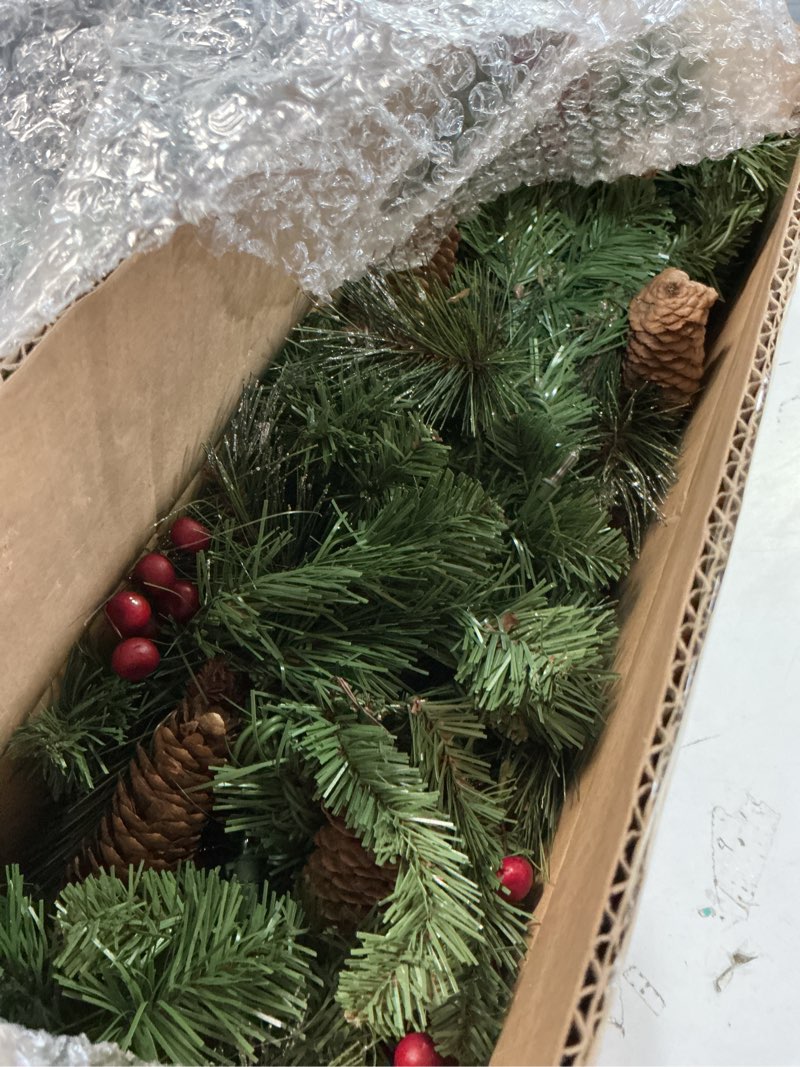 Condition photo showing Good Condition for National Tree Company 9 ft Pre-Lit Crestwood Spruce Artificial Christmas Garland, Christmas Decoration with Glitter, Pinecones, Red Berries, 50 Clear Lights, 180 Tips, Green Plug In Tree