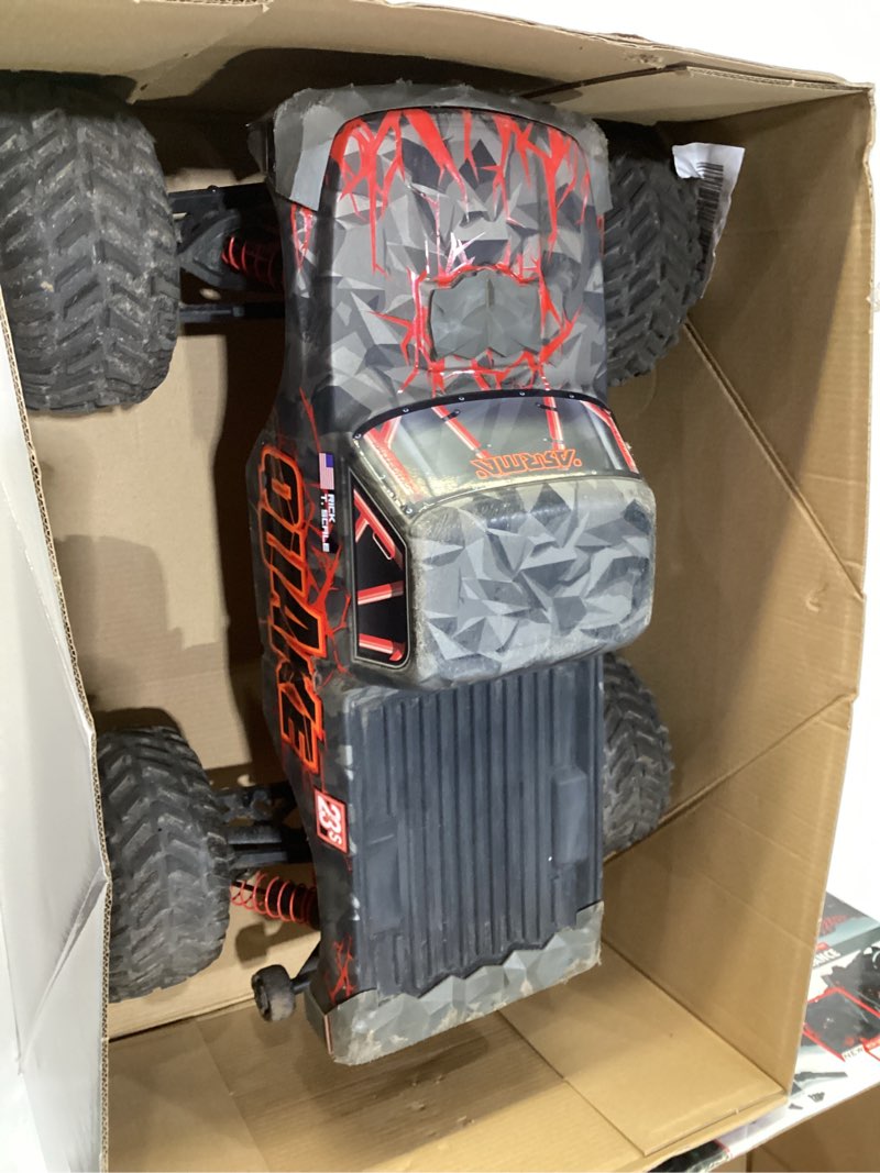 Condition photo showing As Is for ARRMA RC Truck 1/10 Quake 223S 2WD RTR (Battery and Charger Not Included) Brushless Monster Truck, Red, ARA3537T1, USED, NOT TESTED