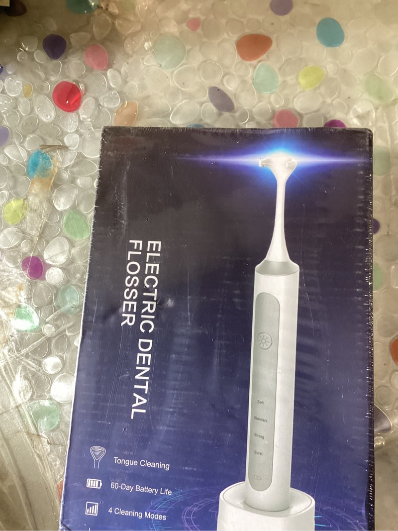 Condition photo showing New/Like New for rechargeable electric flosser–4-speed dental flosser with 60 heads & tongue cleaner – contactless charging base for adults & kids – dentist-approved gum care & water flosser alternative