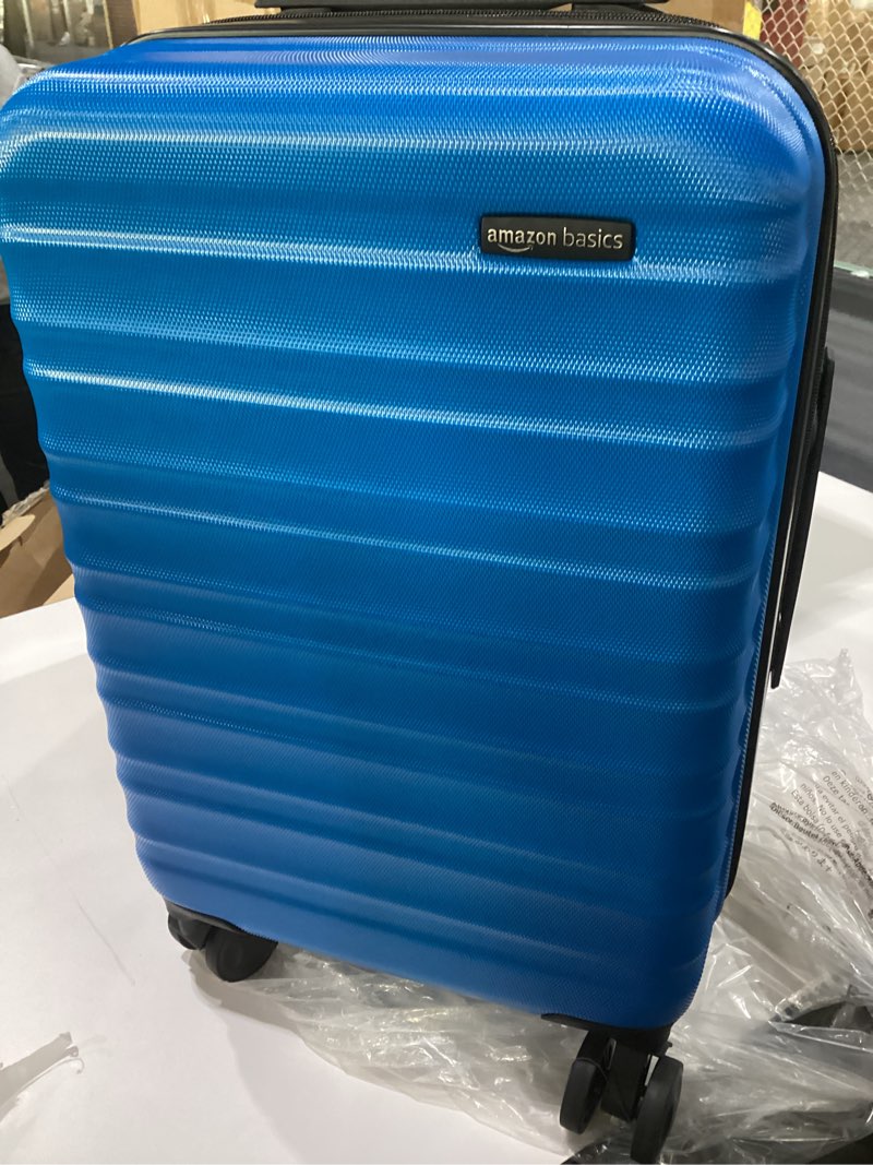 Condition photo showing New/Like New for Amazon Basics 21\" Hardside Carry-On Luggage, Hardshell Suitcase With Wheels, Expandable For Up to 25% More Space, With Scratch-Resistant Surface, Four Multi-directional Wheels, Navy Blue Navy Blue Carry-On, SIMILAR TO STOCK PHOTO 