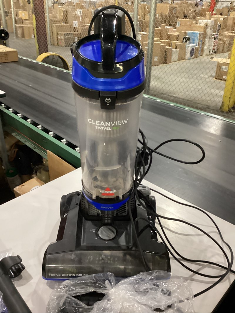 Condition photo showing As Is for *not tested* bissell cleanview swivel vacuum with triple action brush roll, swivel steering, extension wand, easy-empty dirt tank, multi-cyclonic suction system, new 2024 model royal blue