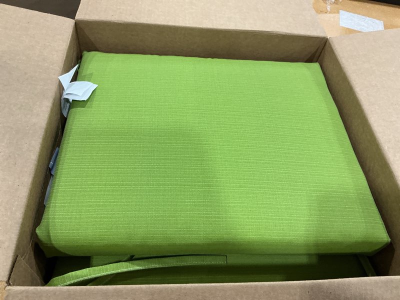 Condition photo showing New/Like New for pillow perfect pompeii solid indoor/outdoor patio seat cushions plush fiber fill, weather and fade resistant, square corner - 20" x 20", green, 2 count green square corner - 20" x 20"