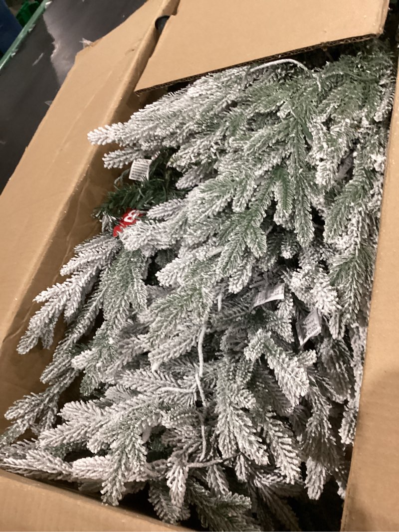 Condition photo showing As Is for Puleo International 4.5ft Pre-Lit Potted Flocked Arctic Fir Christmas Tree with 70 Clear Lights, 419 Realistic Dense Snow Flocked Branch Tips, Easy Setup Artificial Trees with Sturdy Stand 4.5' Flocked Arctic Fir with 70 Clear Lights