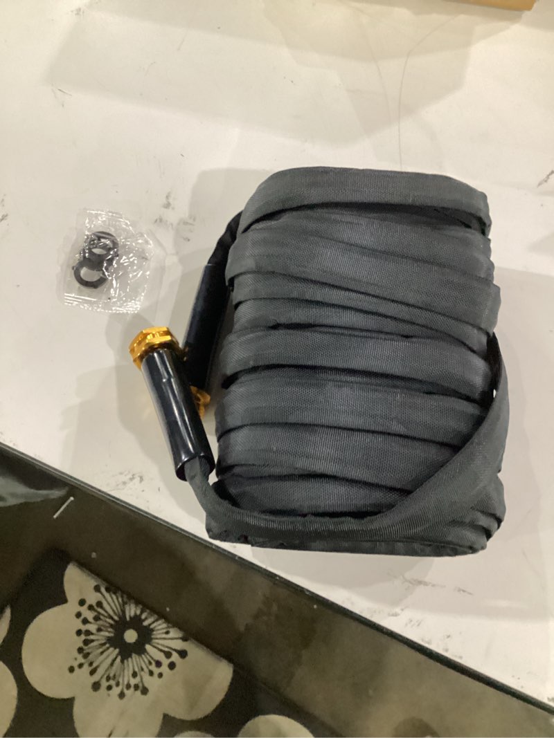 Condition photo showing Good Condition for toolasin garden hose 50 ft, non-expanding, lightweight water hose with 3/4" | easy storage, portable and flexible kink-free pvc inner core, 500 psi burst strength outdoor hose for garden, yard and lawn dark black 50ft