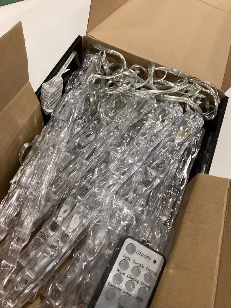 Condition photo showing As Is for 72441 - GE Color Effects® LED 20pc Ice Crystal Icicle Set, 100ct, RGB