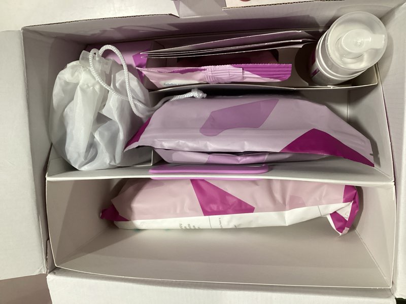 Condition photo showing New/Like New for Frida Mom 11pc Postpartum Essentials Kit Gift Set, Hospital Bag Must Haves for New Mom, Includes 4 Disposable Postpartum Underwear, 4 Ice Maxi Pads, Perineal Healing Foam & 24 Pad Liners & Peri Bottle Postpartum Kit
