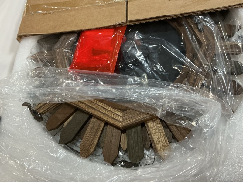 Condition photo showing Good Condition for Honiway 14 Inch Wall Clock, Rustic Wood Boho Sunburst Decorative Wall Clocks Battery Operated Silent Non Ticking Farmhouse Small Wall Clocks for Living Room Kitchen Bedroom Home Decor (Tricolor) Tricolor 14 inch