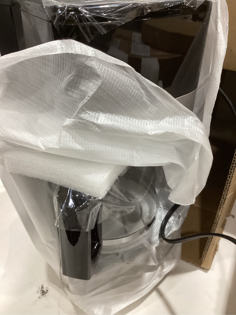 Condition photo showing Good Condition for Amazon Basics 12 Cup Drip Coffee Maker, Coffee Machine with Glass Coffee Pot (1.9 Qt), Auto Shut-off, Auto Pause, Removable Filter Basket, Black & Silver 12-Cup Non-Programmable - New Model