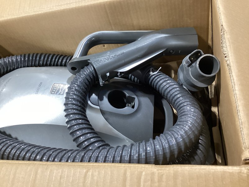 Condition photo showing As Is for kenmore elite 21814 pet friendly crossover lightweight bagged hepa canister vacuum with pet powermate, extended telescoping wand, retractable cord, 2 floor nozzles, and 4 cleaning tools-silver/gray kenmore elite pet powermate + dirt sensing technology