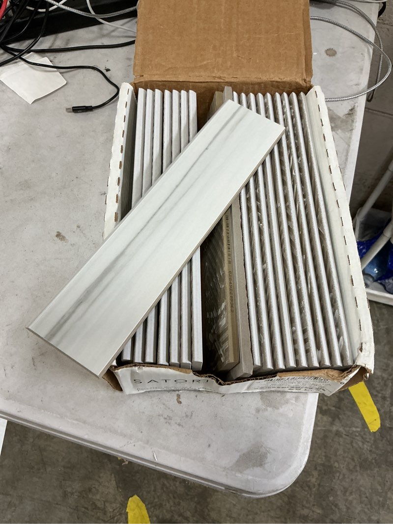 Condition photo showing As Is for Satori Zebrino Ash 3-in x 12-in Porcelain Bullnose Tile
