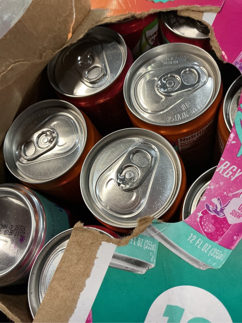 Condition photo showing New/Like New for (bb/11/2027) alani nu variety pack cherry twist, pink slush, orange kiss sugar free, low calorie energy drinks, 200mg caffeine, biotin b vitamins, zero sugar, 10 calories, 12 fl oz cans, 12 pack