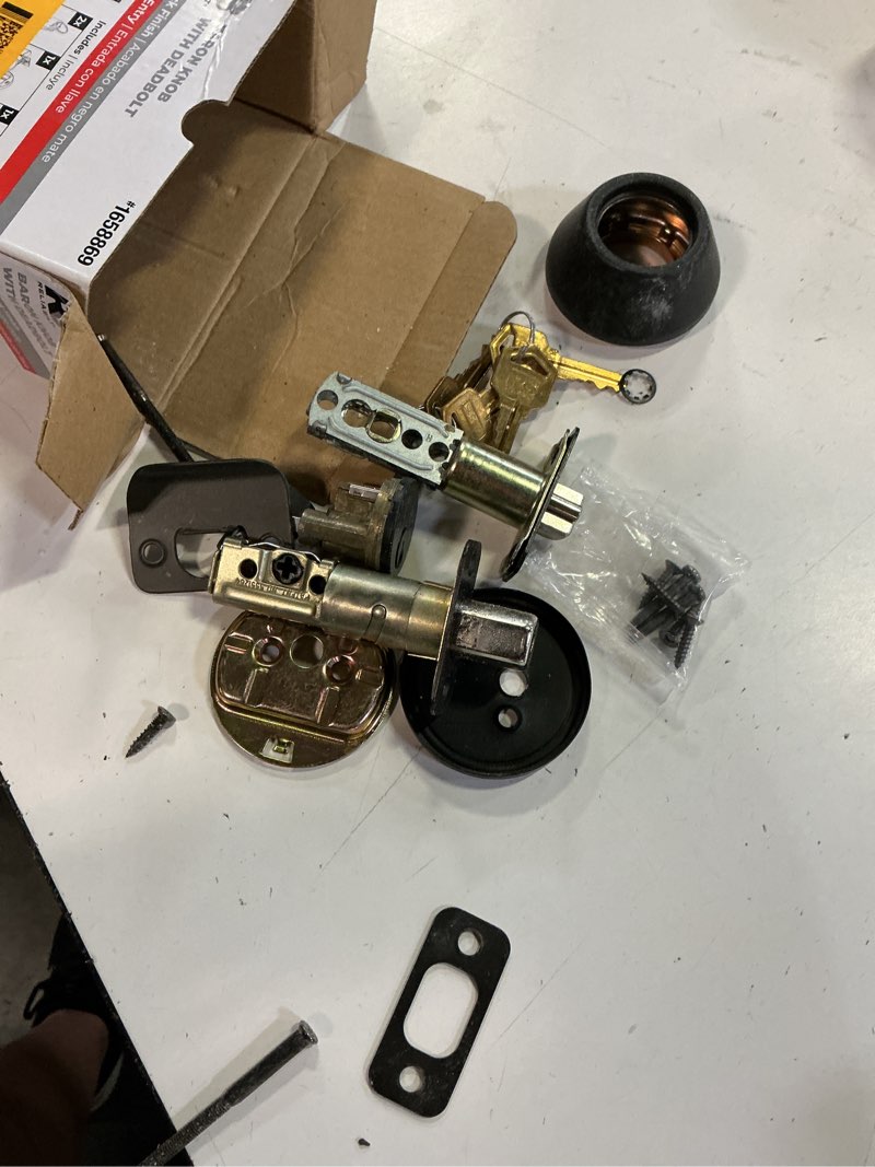 Condition photo showing As Is for reliabilt baron matte black exterior single-cylinder deadbolt keyed entry door knob combo pack