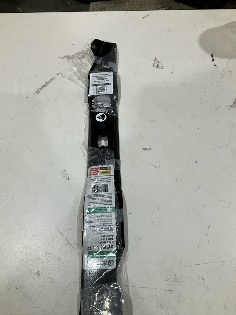 Condition photo showing As Is for original equipment 3-in-1 blade for 21 in. walk-behind lawn mowers with a bow-tie center hole oe# 942-0741