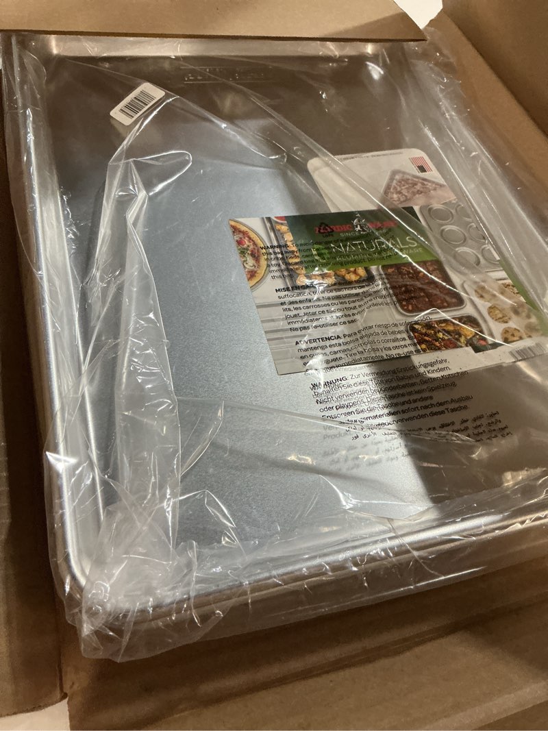 Condition photo showing New/Like New for nordic ware naturals half sheet set - usa made aluminum commercial quality sheet pan for baking or roasting, encapsulated galvanized steel rim prevents warping, 2pk half + lid