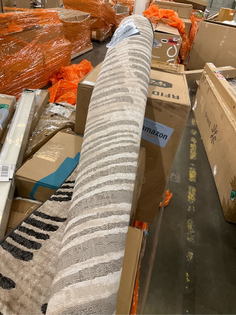 Condition photo showing As Is for Loloi Amber Lewis Josie Collection JOS-04 Ink/Earth 7'-6" x 9'-6", .13" Pile Height, Low Profile, Machine Washable, Area Rug Ink / Earth 7'6" x 9'6" (Rectangular)