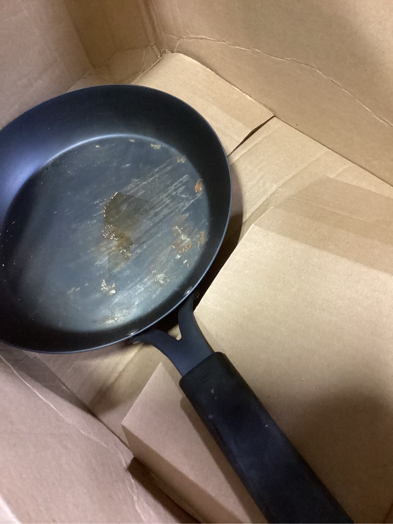 Condition photo showing As Is for OXO Obsidian Pre-Seasoned Carbon Steel, 10" Frying Pan Skillet with Removable Silicone Handle Holder, Induction, Oven Safe, Black