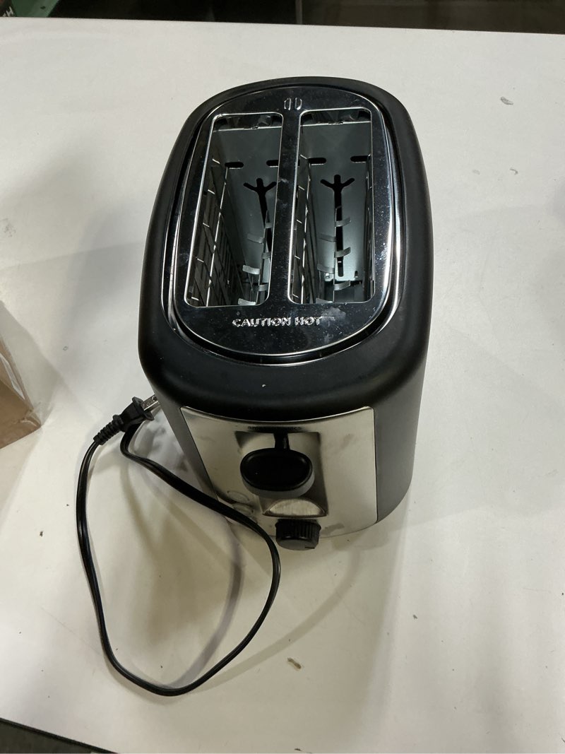 Condition photo showing Good Condition for Amazon Basics 2 Slice Toaster, With 6 Browning Settings, Extra Wide Slots For Bagels and Special Breads, Removable Easy-to-Clean Crumb Tray, Cancel/Defrost/Bagel Buttons, 900W, Black & Silver 2 Slice Silver Front