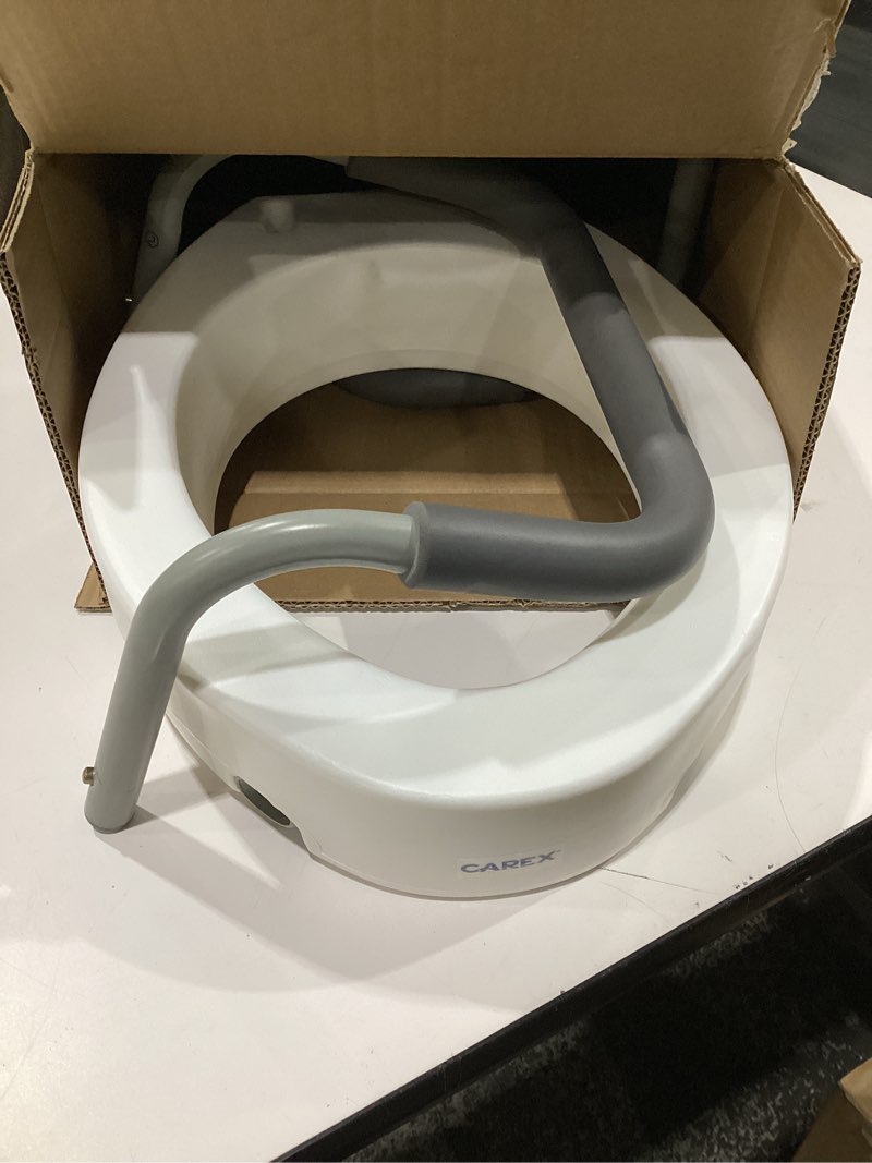 Condition photo showing Good Condition for Carex 3.5 Inch Raised Toilet Seat with Arms, Elongated Toilet Seat Riser, 300 lbs Capacity, Elevating and Raising Seat for Elderly and Handicap, Universal, Slip-Resistant with Padded Handles, White