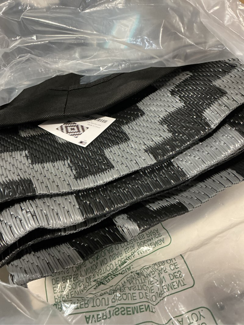 Condition photo showing Good Condition for sand mine waterproof outdoor rug 5x8 ft, plastic reversible rug, modern area rug, large floor mat for outdoors, rv, patio, backyard, deck, picnic, beach, camping, black grey lattice black & grey 5'x 8'