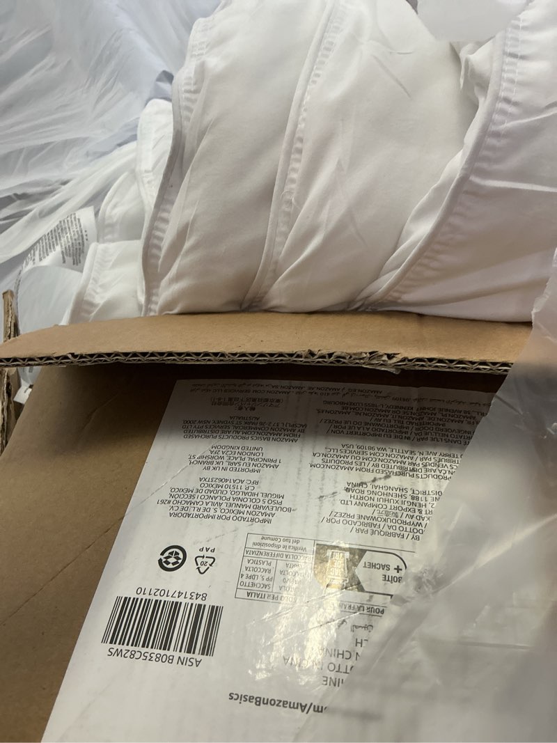 Condition photo showing As Is for amazon basics white down alternative comforter and duvet insert with corner tabs, machine washable, twin, warm twin warm