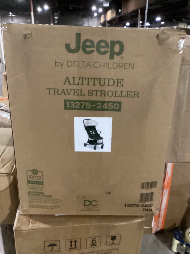 Condition photo showing New/Like New for jeep altitude compact travel stroller by delta children greenguard gold, easy one hand fold, lightweight, extendable canopy with peek-a-boo window, reclining seat, 4 wheel suspension, tan