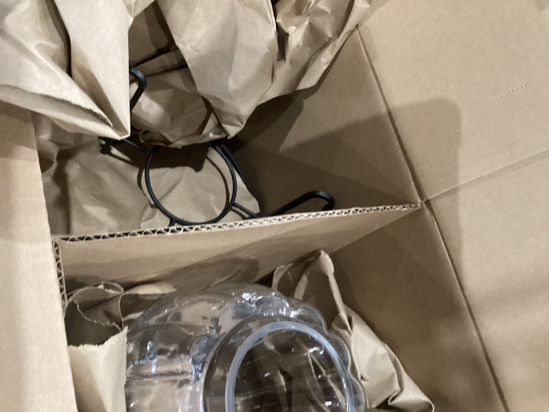 Glass vase with black metal stand