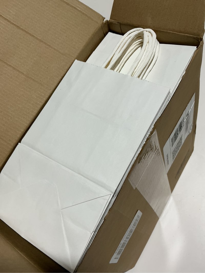 Condition photo showing Good Condition for XPCARE 200Pcs Paper Gift Bags 5.25x3.25x8.25'', Gift Wrap Bags with Handles White Kraft Paper Bags for Small Business Paper Bags Bulk for Birthday Party Favors Shopping Retail 1 Count (Pack of 200) White