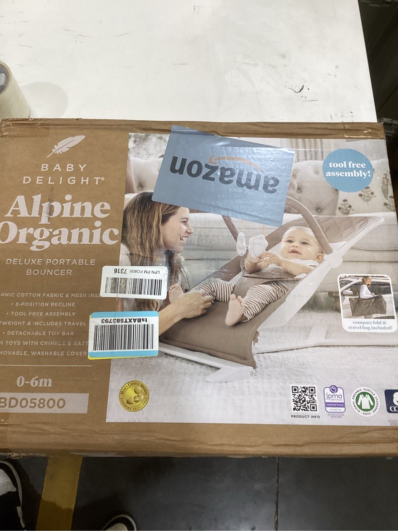 Condition photo showing New/Like New for baby delight alpine deluxe portable baby bouncer | infant | 0-6 months | 100% gots certified organic cotton fabric | organic mocha organic mocha deluxe