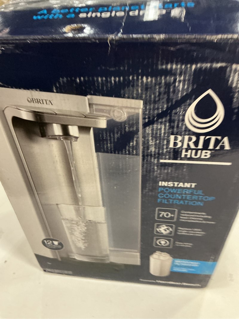 Condition photo showing New/Like New for brita hub instant powerful countertop water filter system, reduces 70+ contaminants, 12 cup water reservoir, includes 6 month carbon block filter, white, 87340