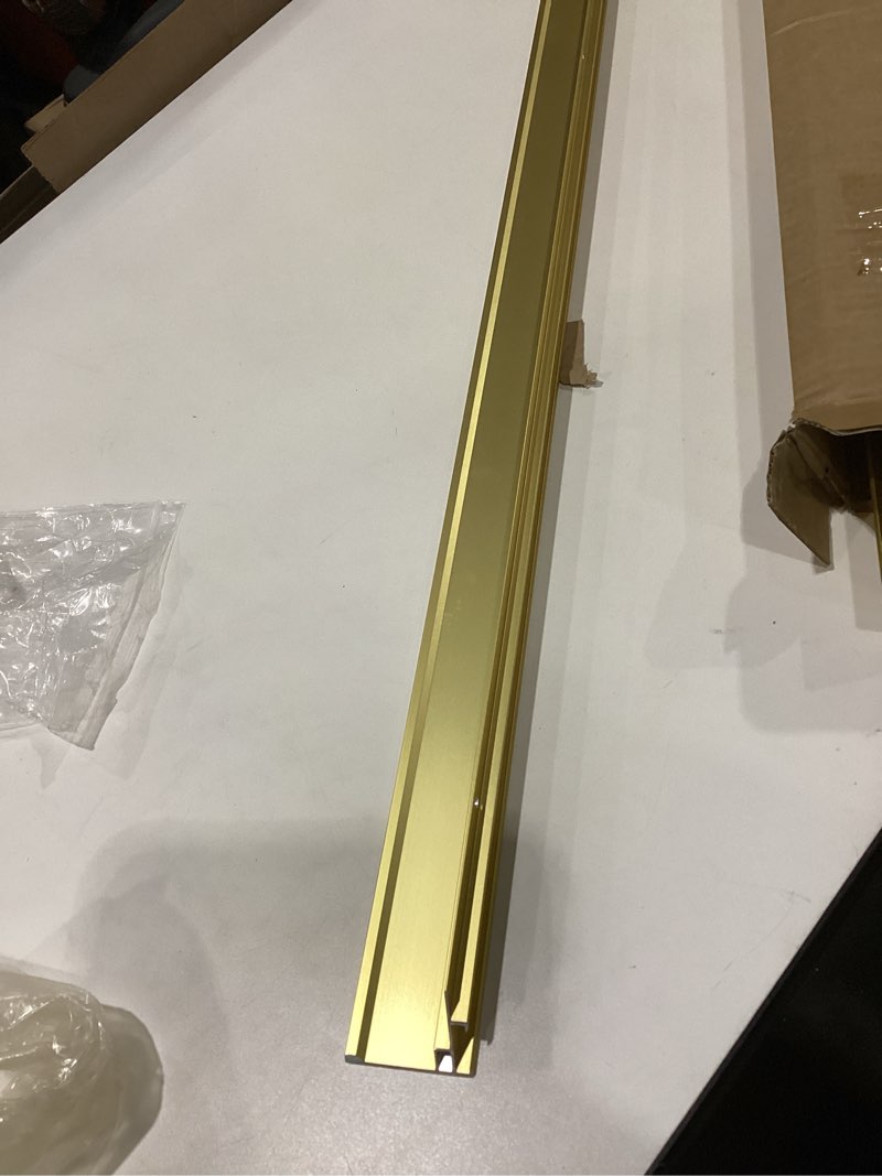 Condition photo showing As Is for m-d building products 79020 1-1/8 in. x 1-1/8 in. x 36 in. satin brass aluminum stair edging w/screw nails, similar to stock photo