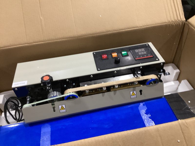 Condition photo showing As Is for (simila)vevor continuous bag band sealing machine, 0.24-0.47 in seal width, horizontal band sealer machine with ink printing, temp & speed adjustable, heat sealing machine for 0.001-0.03 in plastic bags