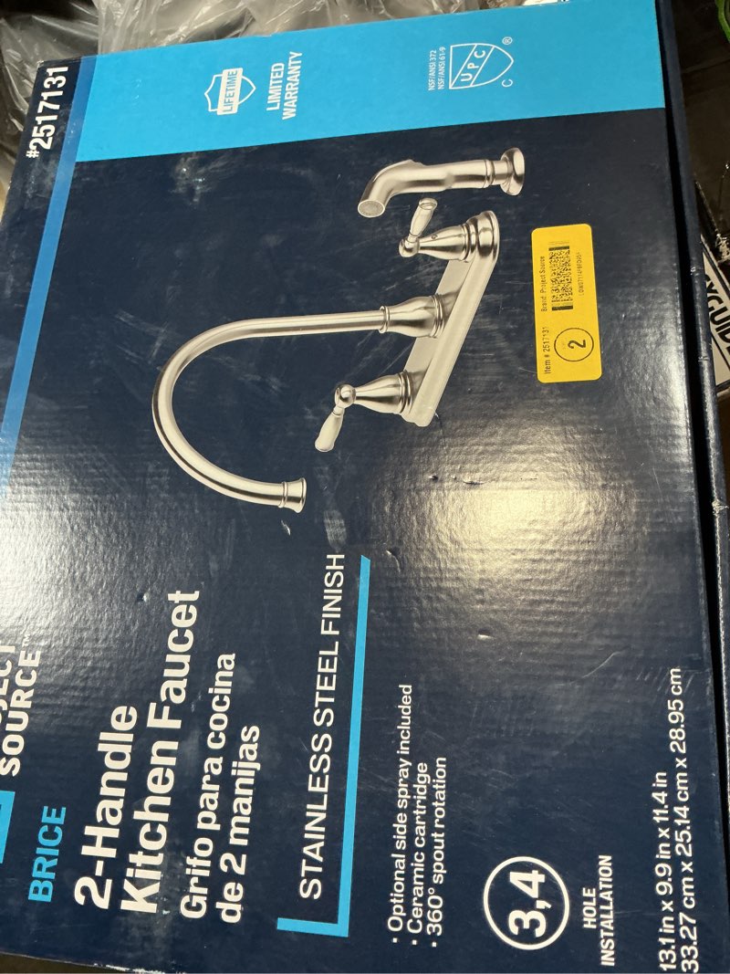 Condition photo showing As Is for project source brice stainless steel double handle kitchen faucet (deck plate and side spray included)