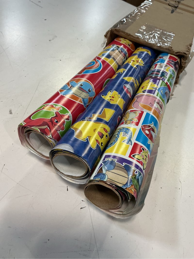 Condition photo showing As Is for Hallmark Pokémon Wrapping Paper Rolls - Pikachu, Charmander, Bulbasaur Gift Wrap Paper (Set of 3 Rolls: 60 sq. ft. ttl.) for Birthday, Kids Parties, Gamers, Christmas Presents