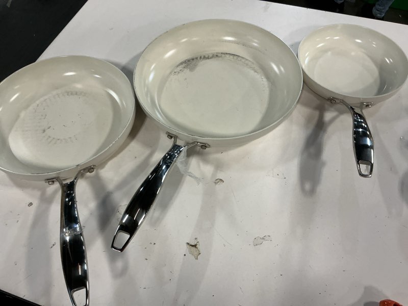 Condition photo showing Good Condition for Amazon Basics Ceramic Nonstick Cookware, 3-Piece Set of Pans, All Cooktop Friendly, Dishwasher-Safe, Ivory