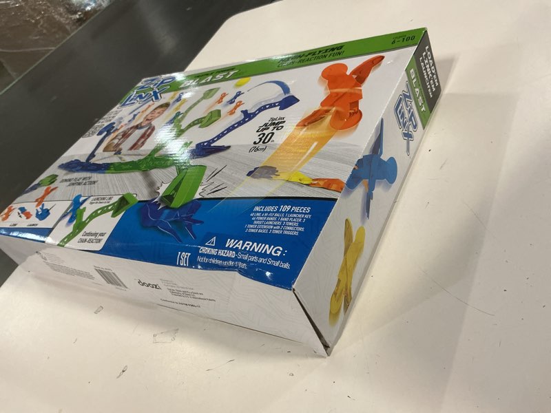 Condition photo showing New/Like New for ZipLinx Jumping Domino Action - Triple Tower Blast | Chain Reaction Game - Create Unlimited Designs | Includes 40, 6 Hi-Fly Balls, 3 Launchers & Towers