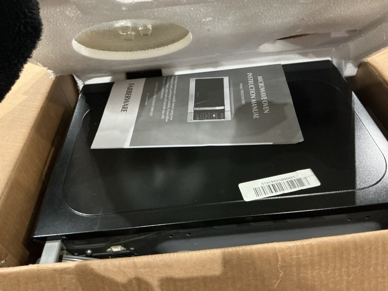 Condition photo showing Good Condition for farberware 0.7 cu. ft. countertop microwave oven – 700 watts power, auto cook settings, defrost, easy clean and child safety lock - stainless 0.7 cu. ft. stainless steel