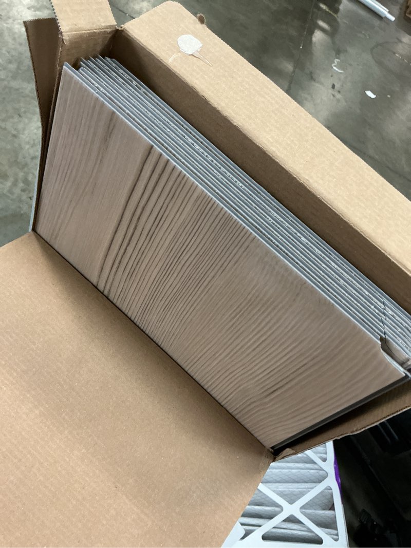 Condition photo showing As Is for stainmaster elkton pine brown 22-mil x 9-in w x 47-in l waterproof interlocking luxury vinyl plank flooring (18.78-sq ft/ carton)