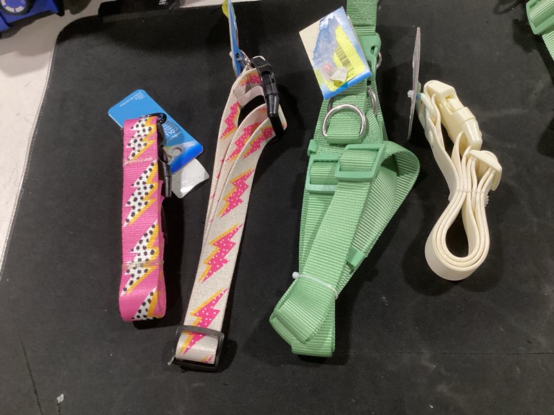 Condition photo showing Good Condition for (qty 4, color & style may vary) assorted lot of size large dog collars and harnesses