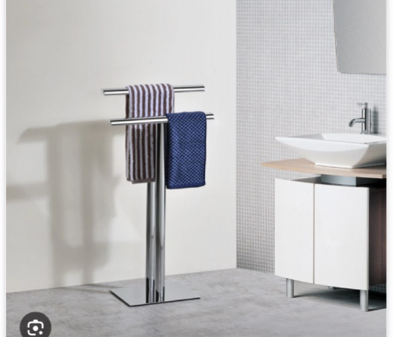 freestanding bathroom towel rack stand with two chrome bars and weighted base for hanging bath towels and washcloths in compact spaces with sleek metal frame and vertical modern design