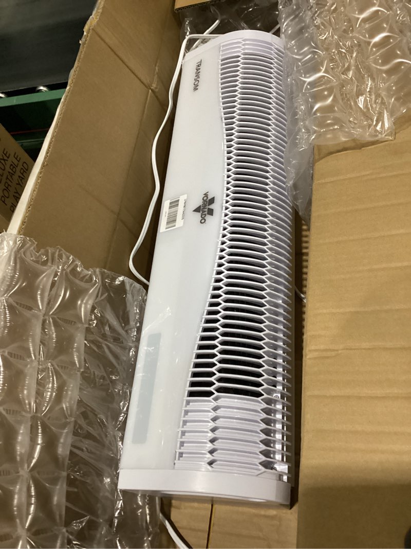 Condition photo showing item condition for vornado transom window fan with 4 speeds, remote control, reversible exhaust mode, weather resistant case, whole room, ice white white remote control fan