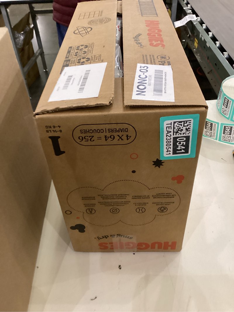 Condition photo showing New/Like New for Huggies Size 1 Diapers, Snug & Dry Newborn Diapers, Size 1 (8-14 lbs), 256 Count (4 Packs of 64), Packaging May Vary
