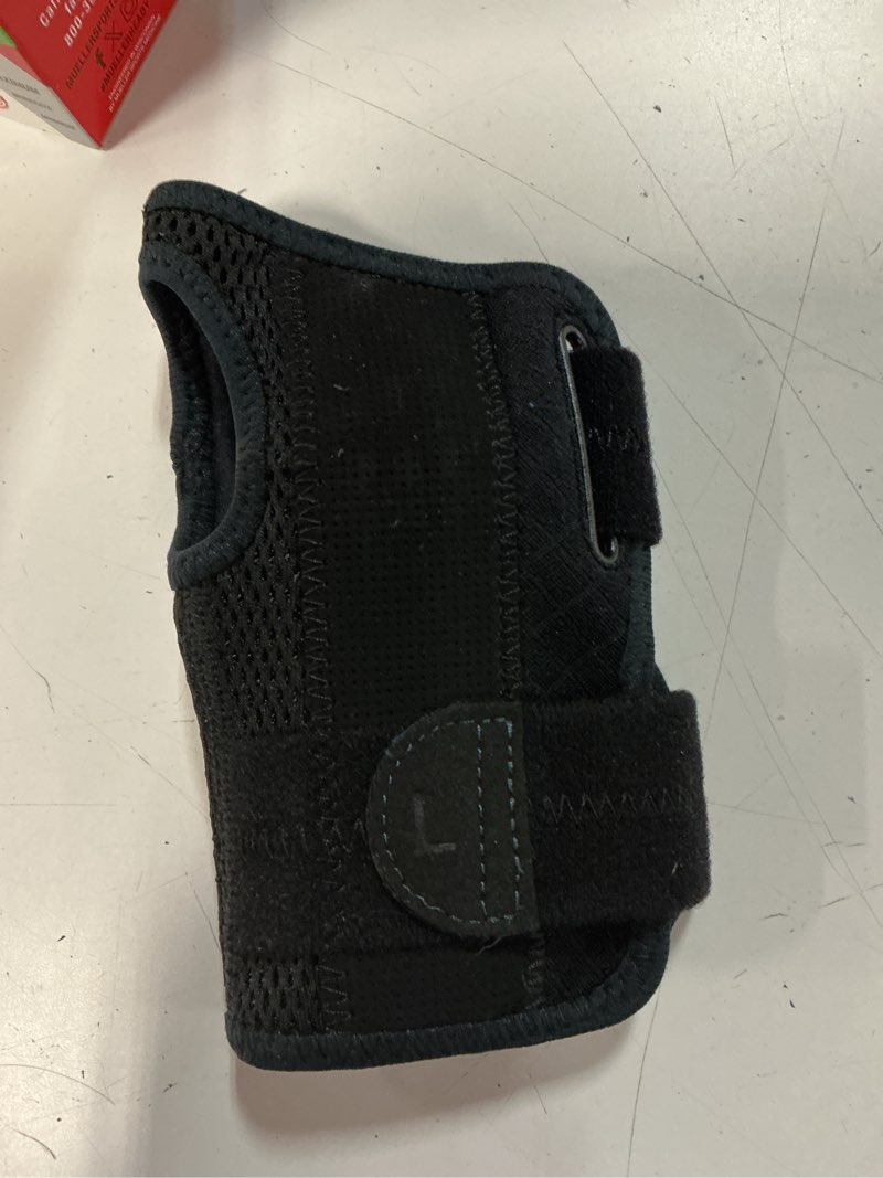 Condition photo showing Good Condition for mueller sports medicine green fitted wrist brace, left, osfm, black