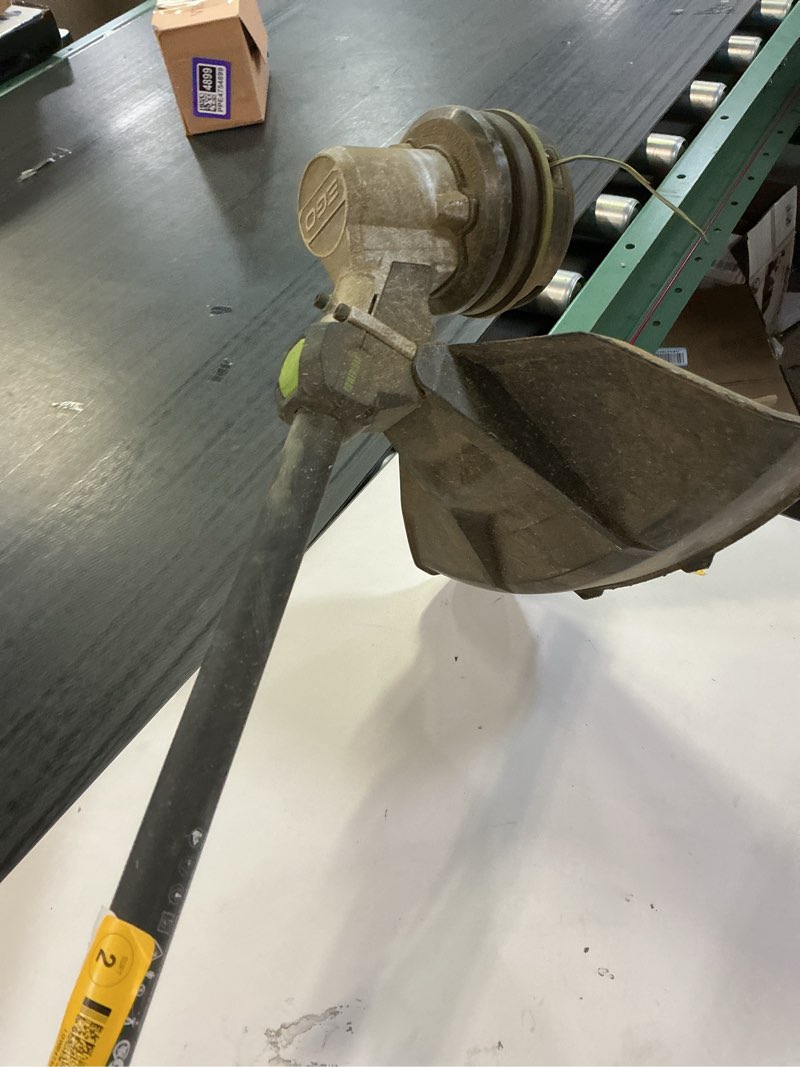 Condition photo showing As Is for ego 56-volt 15-in split shaft attachment capable battery string trimmer 5 ah (battery included)